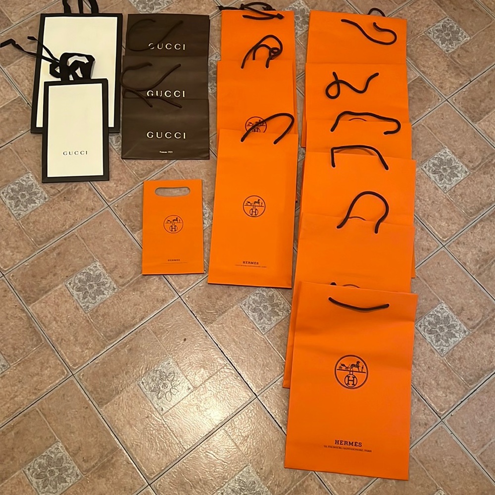 Authentic Hermes and Gucci shopping bags.